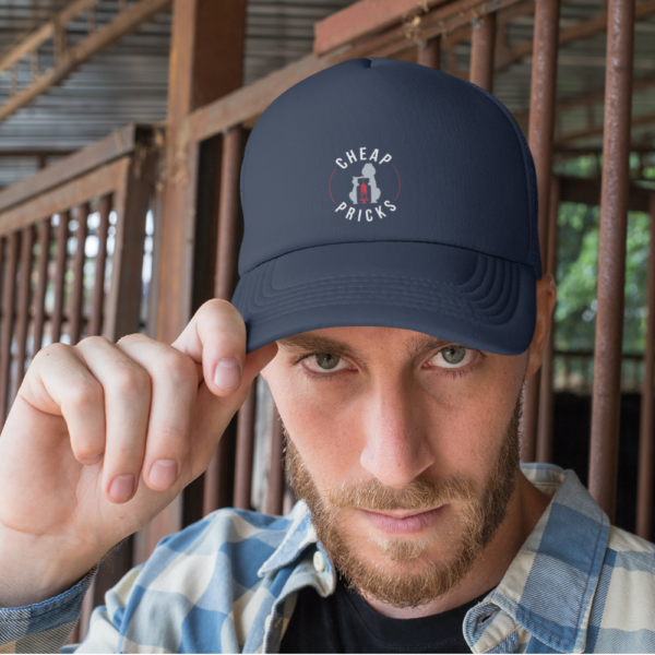 Model wearing navy blue hat with white mesh and embroidered logo